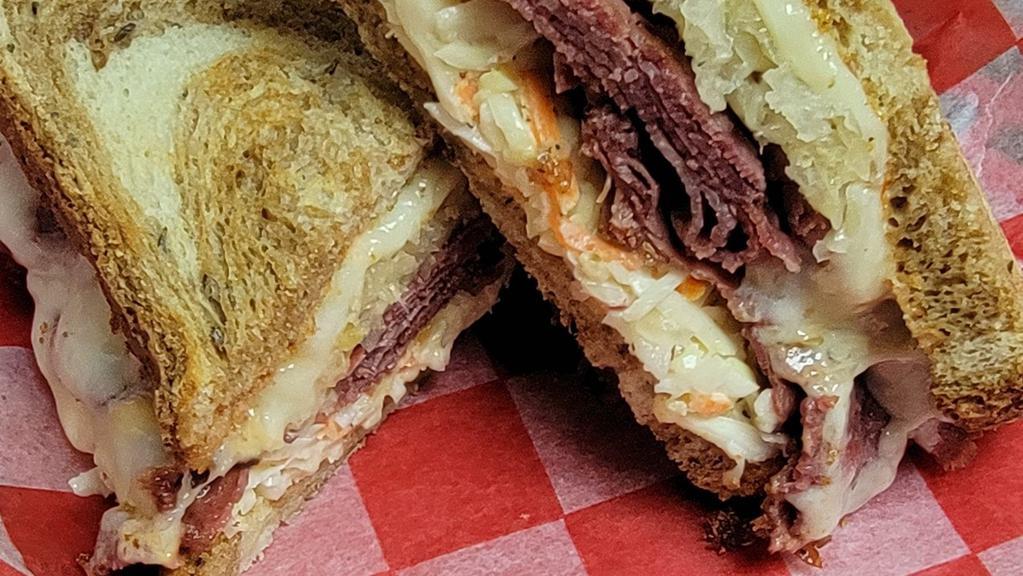 Classic Reuben Sandwich · Corned beef, sauerkraut, swiss cheese and thousand island dressing