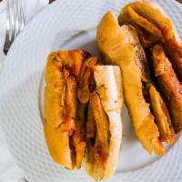Italian Hot Dog · Hot Dogs with Onions, Peppers, Ketchup, Mustard and Steak Fries