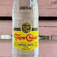 Topo Chico · Sparkling mineral water 12oz bottle.