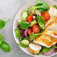 Grilled Chicken Salad · Grilled chicken tossed with mixed greens, boiled eggs, fresh tomato, toasted almonds, and ba...