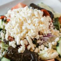 Greek Salad · mixed greens with cucumber, tomato, carrot, red onion, olives, & feta cheese in a vinaigrett...