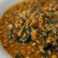 Lentil Soup · Our homemade vegetable broth with lentils onions carrots & spinach.
