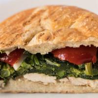 Grilled Chicken Panini · with broccoli rabe & cherry peppers.
