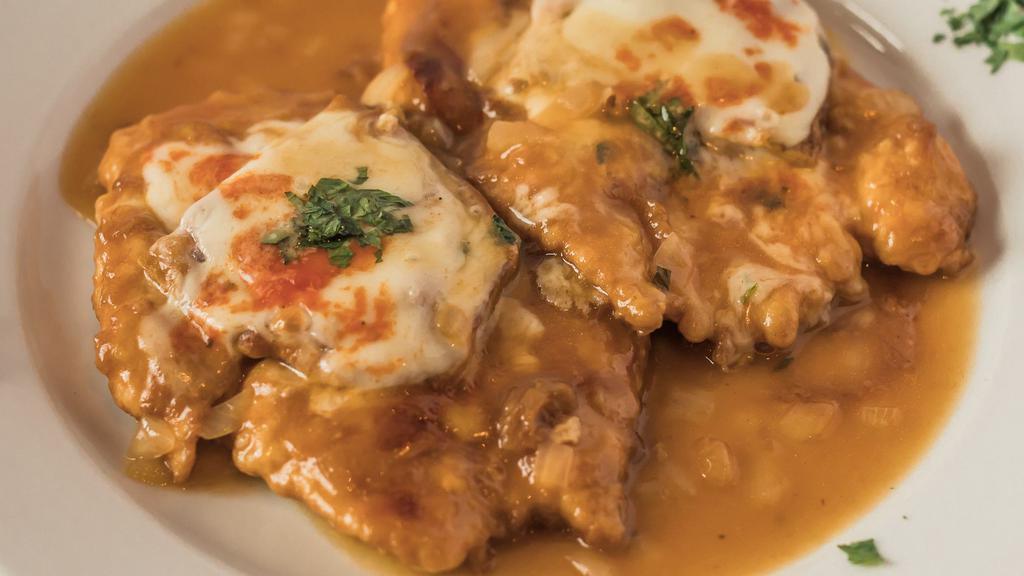Chicken Sorrentino · topped with eggplant, prosciutto & mozzarella in a light brown sauce with onions.