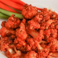 Buffalo Cauliflower · Cauliflower tossed in a spicy vegan buffalo sauce. Served with a side of pasta or salad.