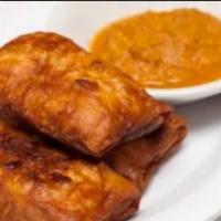 Sambusa · Pastry shells stuffed with spiced beef or mixed vegetables served with dipping sauce. Three ...