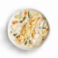 Chicken Potpie · Creamy chicken soup with mixed vegetables and garnished with crumbled pie crust.