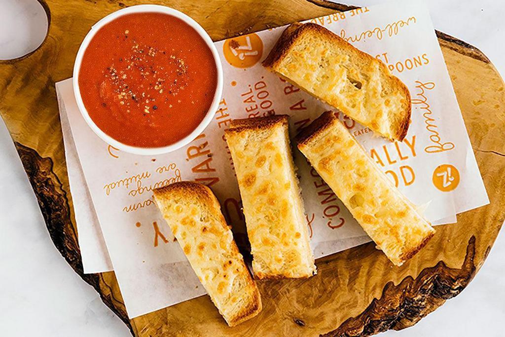 Grilled Cheese Dippers · melty sharp white cheddar on grilled cheesy bread strips served with a side of tomato soup
