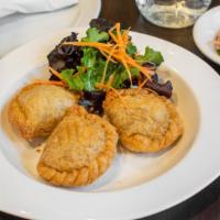 Curry Puffs (Crispy) · Minced chicken, Japanese yam, chopped onion, and Thai herbs stuffed in puff pastry. Served w...