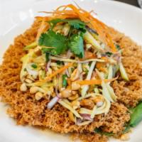 Catfish Salad · Mild. Nest of crispy minced catfish topped with spicy mango salad, red onion, peanut, cashew...