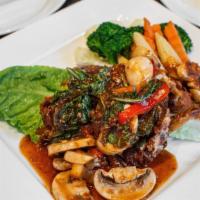 Soft Shell Crab With Chili Sauce · Medium. Crispy soft shell crab served with garlic, mushroom, Thai basil leaves, and bell pep...