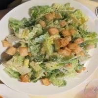 Caesar Salad · Romaine lettuce with Parmesan cheese and croutons.