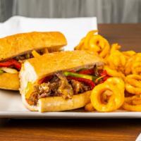 Cheesesteak Sandwich · Roast beef or grilled chicken smothered with peppers and onions topped with melted cheddar s...