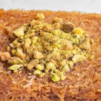 Kunafa · Shredded phyllo dough mixed with butter and filled with a mixture of ground walnuts, hazelnu...