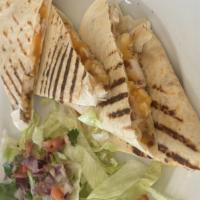 Chicken Quesadilla · Diced bacon, jalapeños, and Cheddar cheese folded in a flour tortilla. Served with sour crea...
