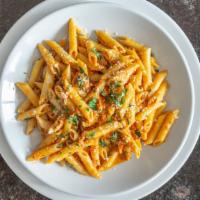 Penne Ala Vodka · Vodka cream sauce with Romano cheese, diced bacon, and shallots. Served with small house sal...