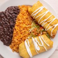 Chicken Chimichangas · Favorite. Two flour tortillas filled with chicken, beans and cheese. Topped with sour cream,...