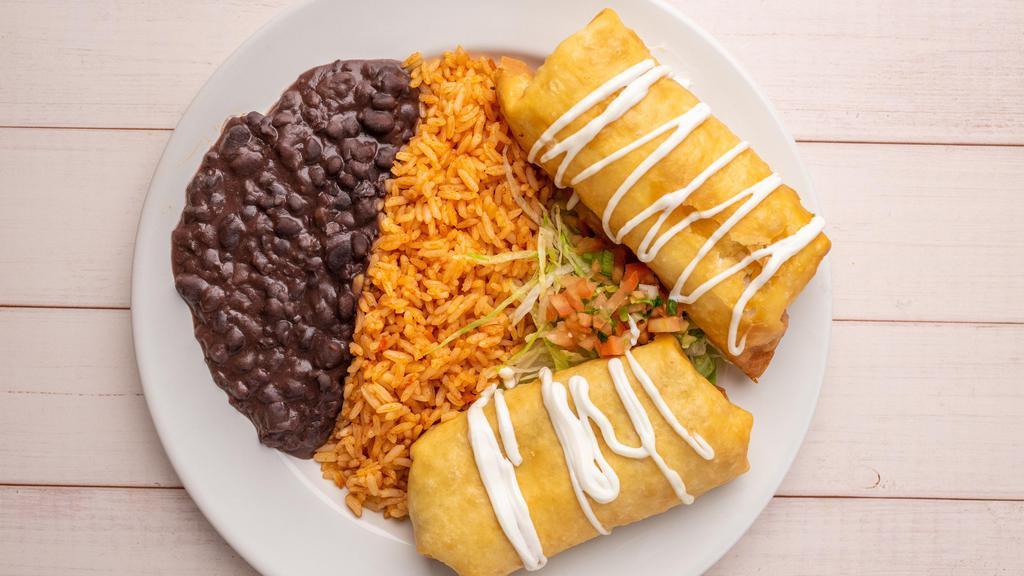Chicken Chimichangas · Favorite. Two flour tortillas filled with chicken, beans and cheese. Topped with sour cream, pico de gallo and lettuce. Served with rice and beans.