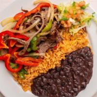 Grilled Steak Fajitas · Marinated steak with sautéed onions and peppers. Served with rice, beans, shredded lettuce, ...