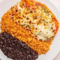 Steak Enchiladas · Two corn tortillas stuffed with steak topped with cheese and salsa. Served with rice and bea...