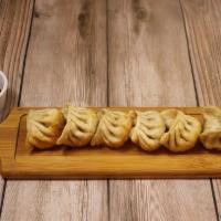 Homemade Vegetable Gyoza (6Pc) · 6 pieces of pan-seared or steamed dumplings stuffed with vegetables. Comes with a side of sa...