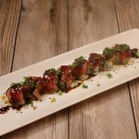 Crazy Tuna Roll · Spicy tuna, crunch, and avocado. Topped with pepper tuna, scallions, ponzu sauce and sweet s...