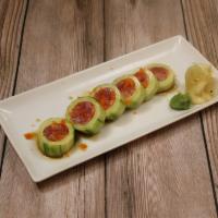 Tri Color Naruto · Fresh salmon, tuna, yellowtail, wrapped in cucumber, topped with masago, and ponzu sauce