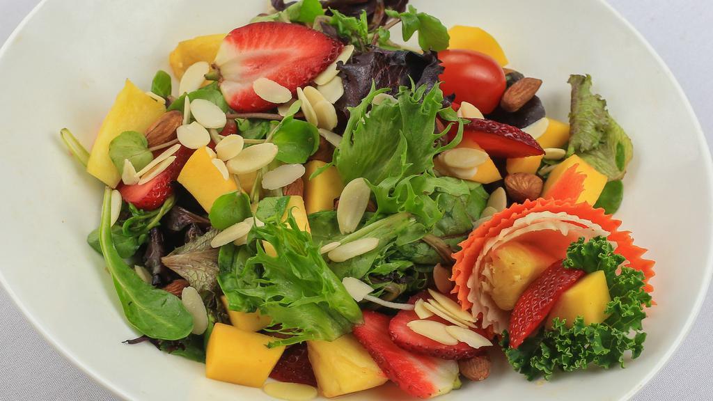 Strawberry Mango Salad · Mixed greens, arugula, mango, strawberry, red onions, shredded white radish, almonds, tropical dressing