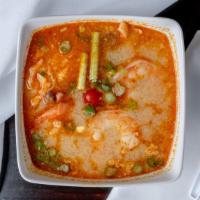 Tom Yum (Shrimp Spicy Herbal Soup) · Spicy lemongrass broth, shrimp, mushroom, tomato and scallion