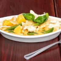 Pineapple Curry · Spicy curry paste with coconut milk, pineapple, basil, bamboo shoot, pepper