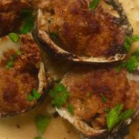 Baked Stuffed Clams (4) · Chopped clams, garlic, mozzarella cheese and seasoned bread crumbs.