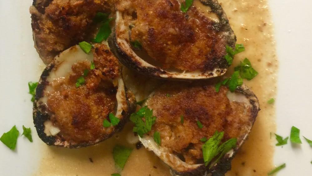 Baked Stuffed Clams (4) · Chopped clams, garlic, mozzarella cheese and seasoned bread crumbs.