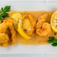 Shrimp Francese · Egg battered shrimp sauteed in a lemon, wine & butter sauce.