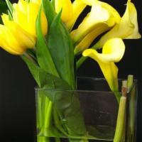 Dali · Sunshine blooms of tulips and Callas in a glass container. Available also in white, pink, pu...
