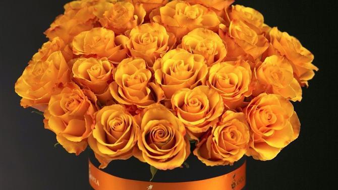 Lyon · Gorgeous two dozen of fresh orange roses stylishly arranged in a flower hat box.