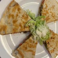Quesadillas · A gooey blend of Jack and Cheddar. Serve with homemade guacamole, salsa, and sour cream.