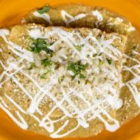 Enchiladas De Pollo · Corn tortillas filled with chicken, rolled, and topped with Salsa Verde Cocida, onions, cila...