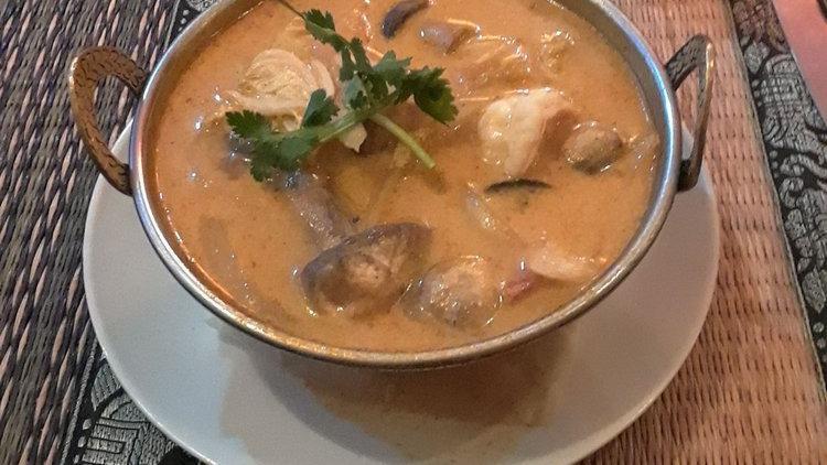 Tom Yum · Gluten Free. Thai hot and sour soup with mushroom, onion, Napa cabbage, carrot, cilantro, sweet chili paste, and coconut cream.