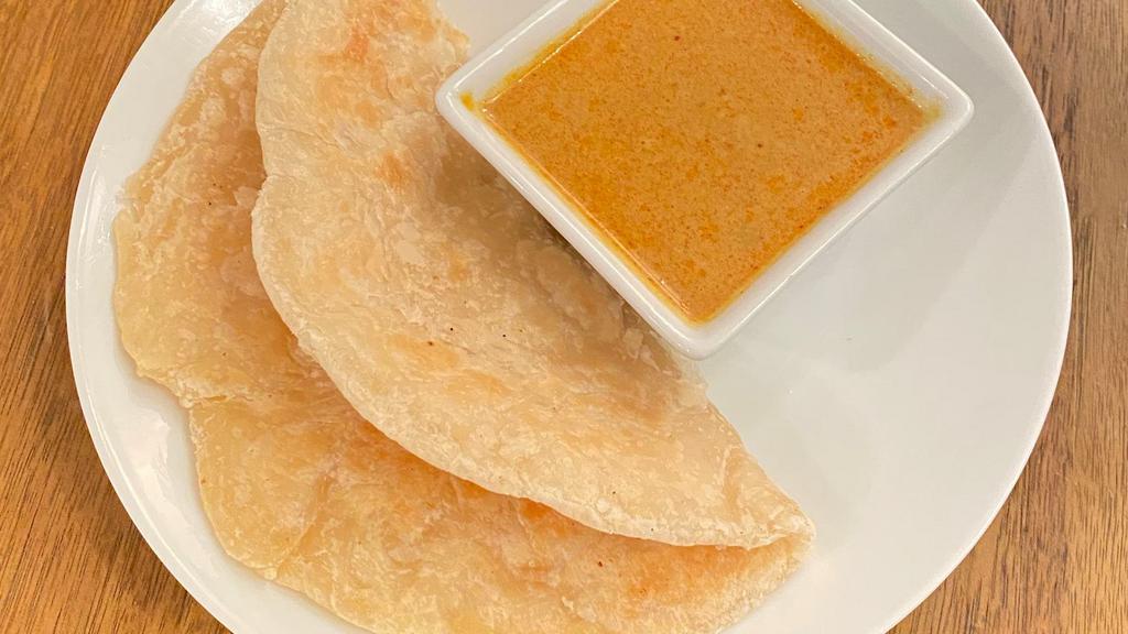 Roti Bread With Curry · Vegan. Grilled thin roti bread, coconut yellow curry dipping.