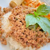 Basil Pork Over Rice · Spicy. Basil, white onion, bell pepper, garlic, chili, Thai basil sauce. Served with salad (...