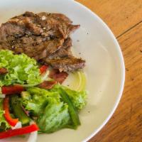 Pepper Steak Salad · Beef steak sauteed with red onion, green peppers, romaine. arugula, tomatoes, cucumbers, oni...