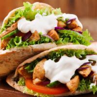 Chicken Gyro Sandwich · Juicy chicken thighs marinated with house spices cooked on the flat grill with onions and pe...