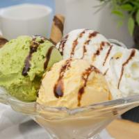 Triple Ice Cream Delight · Green tea, vanilla, mango with chocolate syrup. 695-715 cal.