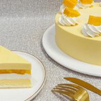 Alphonso Mango Mousee Cake · Fresh Alphonso mango layer with vanilla and mango mouse.