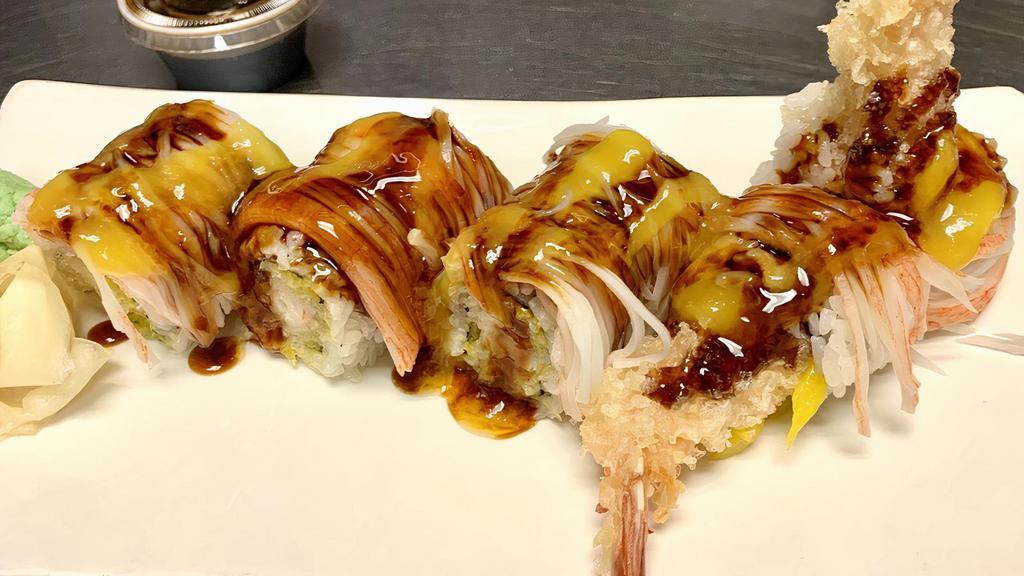 Ocean Roll · A cooked roll with shrimp tempura ,mango inside topped with crabstick, mango sauce and eel sauce.