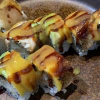 Happy Dragon Roll · A cooked roll with shrimp tempura, cucumber inside top with eel, mango, avocado and mango sa...