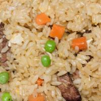 Filet Mignon Fried Rice · Fried rice with filet mignon, peas, carrots and egg.