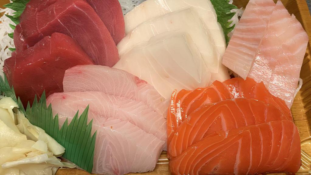 Sashimi Regular · 15 piece sashimi. All raw fish. Served with miso soup or salad.