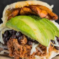 Arepa De Pabellon · Pabellón Arepa - Beef, black beans, sweet plantains,avocado and shredded cheese. Simply EXPL...