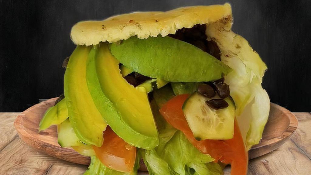 Arepa Vegetariana · Vegetarian Arepa - Arepa Vegetarian - Filled with Lettuce, Tomato, Black Beans, Cucumber, Avocado.Simply EXPLOITED!